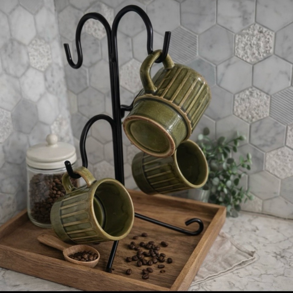 Retro vintage or antique ceramic stacking mugs in green glaze